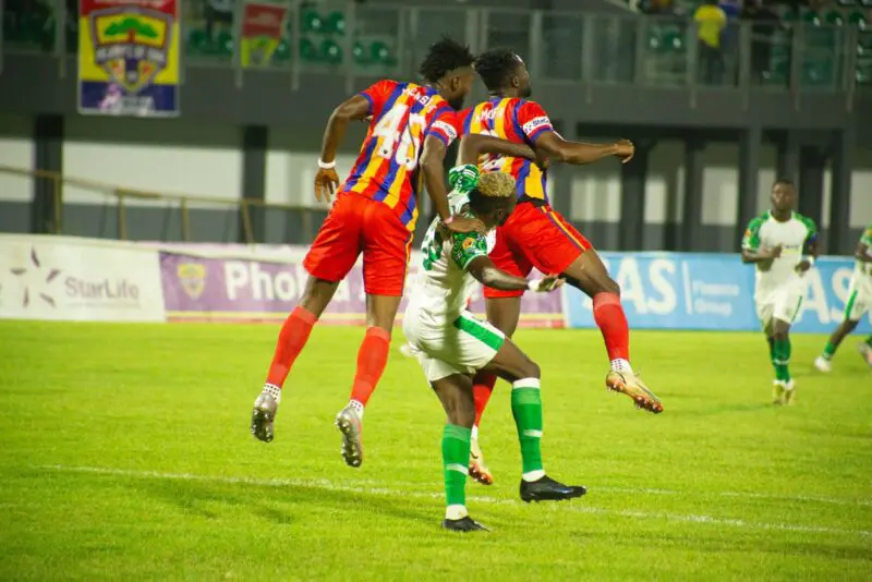 No way! Hearts center backs, Samuel Amofa and Michael Awuah block Vision striker Issah Akukah